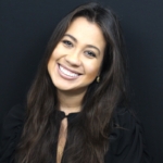 woman in black long sleeve shirt smiling